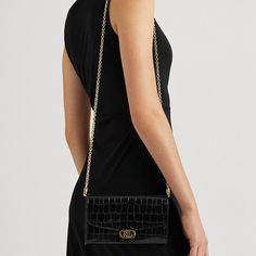 "Find RALPH LAUREN Embossed Leather Adair Crossbody Bag on Editorialist. The Adair crossbody bag is crafted from crocodile-embossed leather. It features a modern chain strap, a compact silhouette, and an array of pockets. The bag is adorned with polished \"LRL\" hardware and a foil-embossed logo, showcasing a signature Lauren Ralph Lauren finish. The Adair can be worn crossbody or on the shoulder. It is a medium-sized bag with a compact design, making it ideal for carrying everyday essentials." Elegant Embossed Crossbody Bag, Elegant Ralph Lauren Crossbody Shoulder Bag, Elegant Ralph Lauren Crossbody Bag, Ralph Lauren Leather Crossbody Shoulder Bag, Elegant Black Ralph Lauren Bags, Luxury Black Shoulder Bag With Rivets, Medium Sized Bags, Women Accessories Bags, Black Cross Body Bag