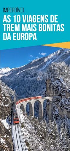 an image of a train going over a bridge in the mountains with snow on the ground