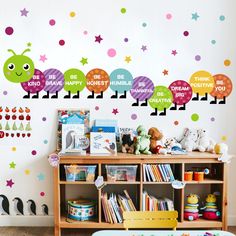 a child's playroom with colorful wall decals and toys on the shelves