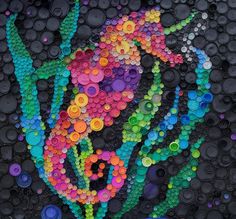 there is a very large piece of art made out of plastic bottle caps and buttons