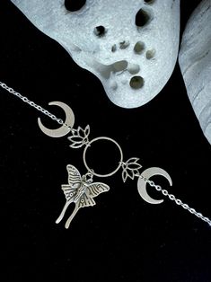 Beautiful Handmade Celestial Moon Phase Luna Moth and Lotus Choker in Silver.･༓ﾟ𐦍༘⋆☾ Celestial Magic! This adjustable choker will make and enchanting statement!  Bold and beautiful!  Designed to Turn Heads! ⋆☽ ༓･.･ ✨P R O D U C T I O N - T I M E ✨ Each pair of my lovingly handcrafted pieces are naturally one of a kind and hand made to order. Please allow 1-3 business days for production. If you have a specific deadline, please let me know and I will do my best to accommodate you! ✨N A T U R A L - V A R I A T I O N ✨ Please note, each piece is innately unique and your pair may vary slightly from the product photos, but will be just as beautiful!  ✨S P E C I A L  Q U A L I T I E S✨ LUNA MOTH Luna moths signify new beginnings as they represent a continuing quest for truth and knowledge, the Moth Luna, Moth Jewelry, Luna Moths, Celestial Magic, Witch Stuff, Necklace Ideas, Luna Moth, Witchy Jewelry, Bold And Beautiful