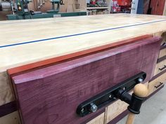 a large wooden workbench in a shop