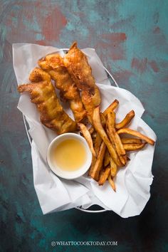 chicken wings and french fries with dipping sauce