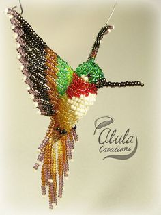 a beaded hummingbird ornament hanging from a hook