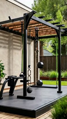 an outdoor gym with swings and exercise equipment