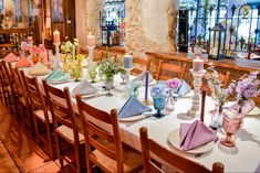 a long table with many plates and napkins on it