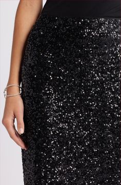 A night-out take on a classic pencil silhouette–this elevated skirt is covered in dazzling light-catching sequins. Lined 95% polyester, 5% spandex Hand wash, dry flat Imported Glamorous Sequin Pencil Skirt, Black Sequined Stretch Pencil Skirts, Embellished Black Party Skirt, Knee-length Sequined Skirt For Night Out, Luxury Black Sequined Skirt, Sequin Pencil Skirt, Pencil Silhouette, Pencil Skirt Black, Autumn Sales