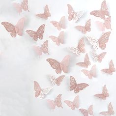 a bunch of pink butterflies on a white background