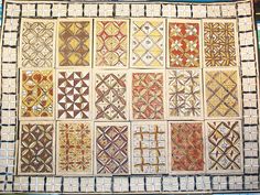 an old quilt with many different designs on it