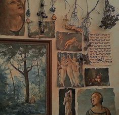 several paintings and pictures hang on the wall