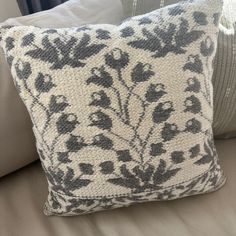 a close up of a pillow on a couch