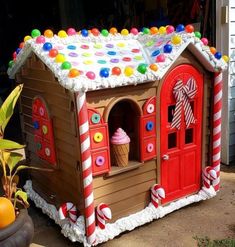 a gingerbread house with candy and candies on the roof