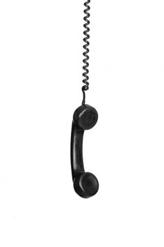 an old fashioned telephone hanging from a cord