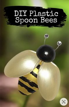 a yellow and black bee sitting on top of a green plant with the words diy plastic spoon bees