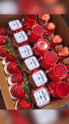 strawberries and cupcakes are arranged in a box with labels for each individual