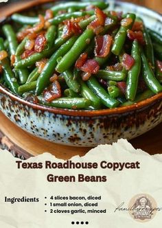 a bowl filled with green beans covered in bacon