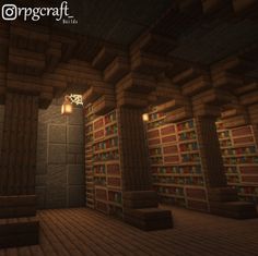 a dimly lit room with bookshelves in the middle and lights on each side