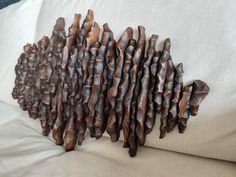 a group of pine cones sitting on top of a white couch