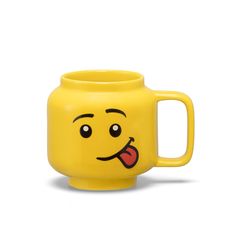 a yellow mug with a face drawn on it