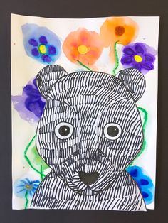 a drawing of a bear with flowers on it's head and eyes in the background