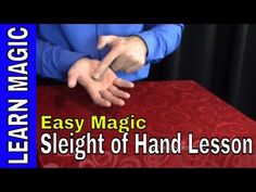 an image of a person making a coin trick with their hands on top of a table