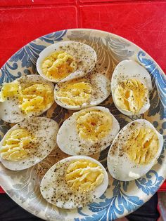 an image of eggs on a plate with seasoning sprinkled on them in blue and white