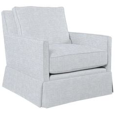 the arm chair is upholstered with ticking fabric