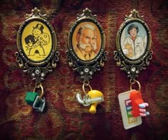 three different key chains with pictures on them