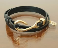 bracelet for woman 18k golf plated fish hook beautiful and unique design with triple wrap flat leather high quality. Looks great on small wrist or large wrist, best gift for mothers day Supervisor Gifts, Gift For Woman, Wedding Jewelry Bracelets, Silver Chain Bracelet, Wedding Bracelet, High Quality Jewelry, Fish Hook, Mother Day Gifts, Best Gift