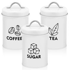 three white canisters with the words coffee, tea and sugar written on them