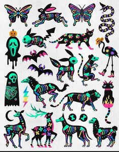 an assortment of colorful stickers on a white paper with black and blue designs in the shape of animals