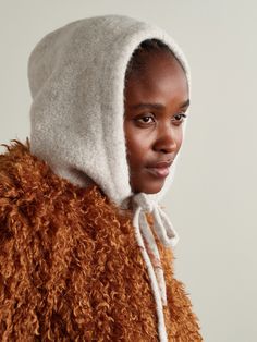 Isabel Marant's hood is a great layering piece that adds both warmth and visual interest to an outfit. Knitted with wool and alpaca threads, it's brushed for a super cozy handle and finished with a leather logo patch. Adjust the drawstring to get your preferred shape. Warm Wool Bonnet For Fall, Cozy Wool Bonnet For Winter, Cozy Beige Bonnet For Fall, Cozy Soft Knit Bonnet For Fall, Fall Cozy Knit Bonnet, Cozy Knit Bonnet For Fall, Pink Holiday, Knitted Hood, Fp Movement