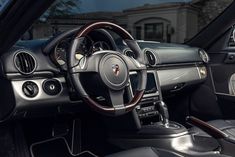 the interior of a luxury car with leather and chrome trims, including steering wheel