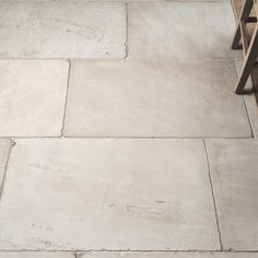 With its pale grey and ivory flecks, Seaton reminds us of classic Portland stone – it’ll go with just about everything. It’s slightly coarser in texture than some of our other tiles, so it’s one for people who like stone with character. Sandstone Floor, Whimsical Garden Ideas, Stone Floor Tiles, Sandstone Tile, Cottage Flooring, Coastal Flooring, Hall Flooring, Sandstone Tiles, Kitchen Floors