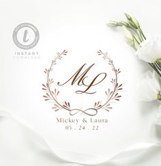 two white flowers are sitting next to each other on top of a table with the initials m and l