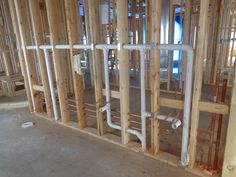 the inside of a building being constructed with wooden framing