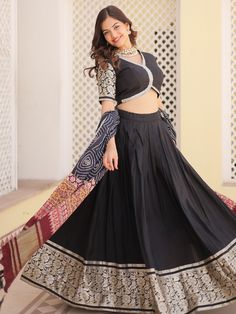 This stunning ensemble features intricate zari weaving work on the black color jacquard lehenga, choli, and dupatta, giving you a regal and elegant look. The lehenga is fully stitched up to 42 inches, and the set includes an unstitched 1-meter choli material for customization.
This ensemble includes the black color jacquard lehenga with zari weaving work, a matching jacquard choli with lace work and zari weaving, and a similar color gaji silk dupatta with printed detailing. This set is perfect f Black Sets With Traditional Drape For Festive Occasions, Festive Black Set With Traditional Drape, Black Floor-length Traditional Wear With Self Design, Black Festive Set With Traditional Drape, Black Lehenga With Unstitched Blouse For Diwali, Fitted Black Anarkali Set In Art Silk, Black Anarkali Lehenga With Self Design, Anarkali Black Lehenga With Self Design, Festive Black Anarkali Set With Self Design