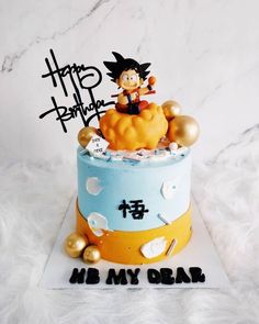 a birthday cake with a dragon on top and gold balls around the edges that say happy birthday, mr my dear