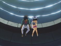 two anime characters standing next to each other in front of a blue light tunnel with white lights on the ceiling