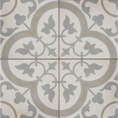 a white and grey tile with an ornate design