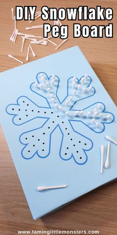 the snowflake peg board is being made with glue and some toothpicks