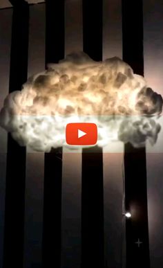 an image of a cloud that is floating in the air with light coming from it