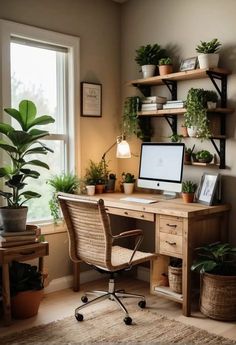 a desk with a computer and some plants