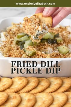 a person dipping crackers into a dish with cheese and pickles on top, along with the words fried dill pickle dip