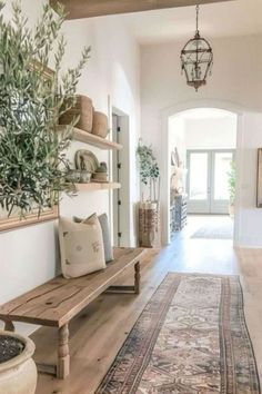 the hallway is clean and ready for guests to use it as an entrance way in this home