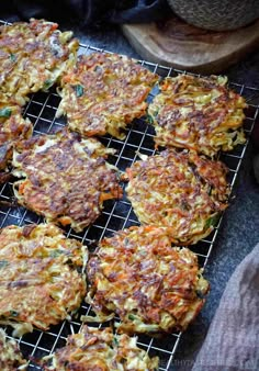 some food is on a cooling rack and ready to be cooked in the oven or used as an appetizer