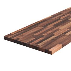 a large wooden cutting board sitting on top of a white surface with no one around it