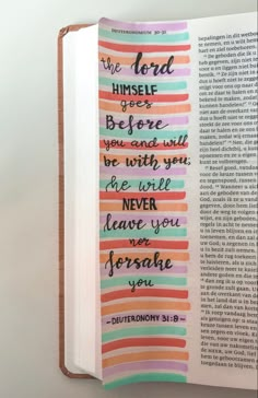 an open bible with the words, the lord himself before you and he will never leave you