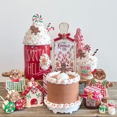 a table topped with lots of decorated cakes and cookies