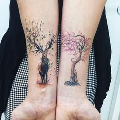 two people with matching tattoos on their arms